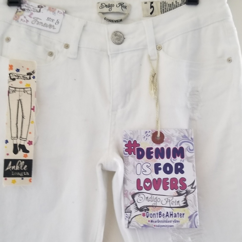 New white Jean's with holes (shown) at knees.
